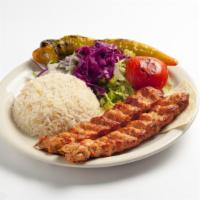 Chicken Adana · Chopped chicken flavored with fresh bell peppers, gently spiced paprika and char-grilled on ...