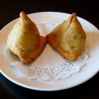 Veggie Samosa · Veggie pastries stuffed with potatoes, peas, cumin, and other spices wrapped in a flaky past...