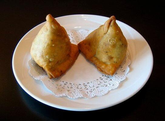 Veggie Samosa · Veggie pastries stuffed with potatoes, peas, cumin, and other spices wrapped in a flaky pastry.