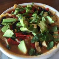 Chicken Tortilla Soup · Chicken, tomatoes and black beans topped with tortilla strips, Monterey Jack cheese, cilantr...