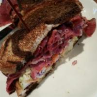 Pastrami Sandwich · Thinly-sliced pastrami on marble rye with pickles, coleslaw, and spicy brown mustard. Spicy.