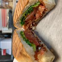 BLT Sandwich · Bacon, arugula, tomato and garlic aioli on focaccia. Served with house pickle.