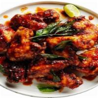 Andhara chilli chicken · Chicken is marinated and deep fried latter tossed with our homemade spicy sauce 