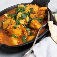 Vindaloo Chicken · Meat and taters dove into a spicy curry to create this delish!.