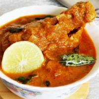 Madras Style Chicken Curry · Farm raised chicken curry, in a semi-gravy (caution: bones).