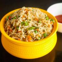 Indian Curry Fried Rice · Rice, stir fried with chicken and / or egg and onions.