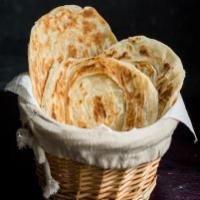 2 Pieces Oor Style Parotta · Our famous Southern style, layered flaky bread. Vegan.