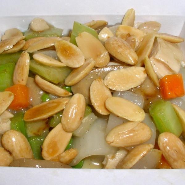33a. Almond Chicken · Diced chicken with carrots, celery and water chestnut in white sauce with almonds on top. With a side of rice.