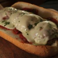 Meatball Parm Sub · Comes with seasoned meat that has been rolled into a ball topped with tomato sauce and chees...