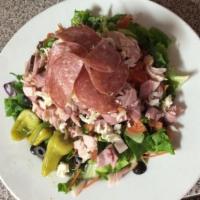 Antipasto Salad · Delightful combination of crispy greens, tomatoes, pepperoncini, olives, pepperoni, salami, ...