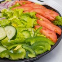 Fresh Garden Salad · Lettuce, tomatoes, cucumbers, red onions, green peppers. Vegetarian-friendly.
