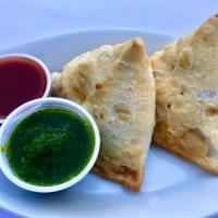 Samosas · Two Savory Pastries filled With Potatoes and Peas. vegan