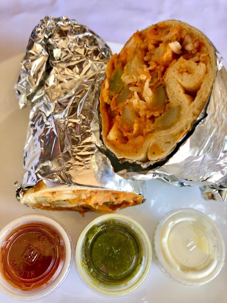 Veggie Naan Burrito! · Veggie Tikka Masala, Paneer Cheese, Chickpeas Curry, Basmati Rice and Pokora Fries All Wrapped Up in a Naan Bread!