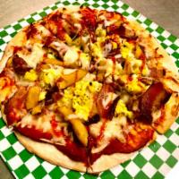 BreakFast Naan Pizza! · Raja Pizza Sauce, Mozzarella Cheese, Bacon, Pokora Fries, Scrambled Eggs, More Mozzarella Ch...