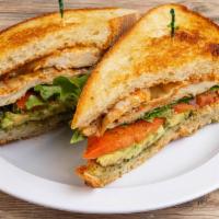 Grilled Chicken Sandwich · Grilled Chicken Breast topped with melted muenster cheese, lettuce, tomato, avocado and our ...