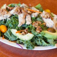 Kale and Avocado Salad · Fresh kale, avocado, carrots, praline walnuts, red onion and tomatoes tossed with balsamic v...