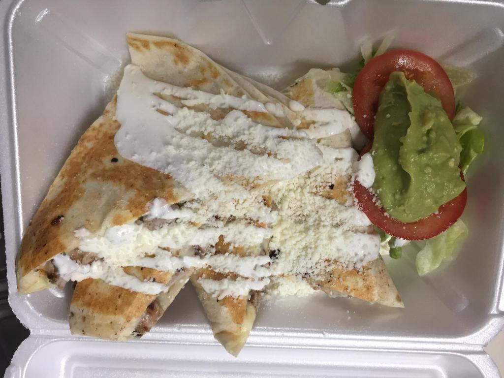 Quesadilla · A warm flour tortilla filled w/ cheese or cheese with your choice of meat