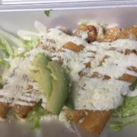 Flauta · A corn tortilla rolled around a cheese filling, deep fried and topped with sour cream, lettu...