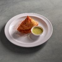 Beef Samosa · Triangular filled pastry with ground beef deep fried.