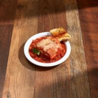 P5. Baked Lasagna · Lasagna pasta with ricotta cheese, mozzarella cheese and ground beef with marinara sauce. In...