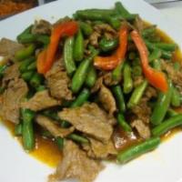 Red Curry · Hot and spicy. Red curry paste, coconut milk, bamboo shoots, green beans, bell peppers and b...