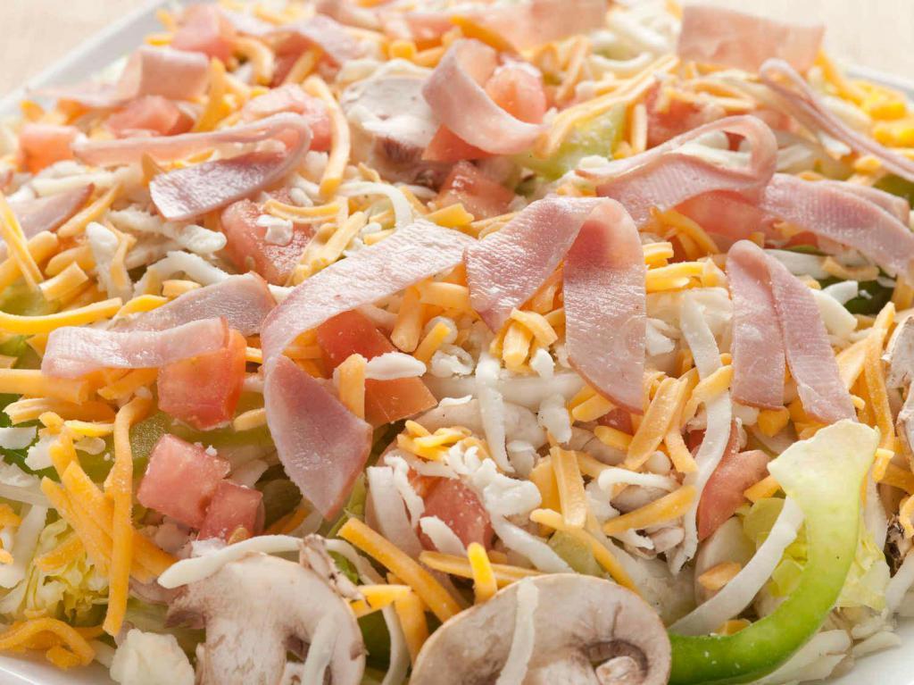 Supreme Salad · Mozzarella cheese, cheddar cheese and Canadian bacon. Includes romaine and iceberg lettuce, mushroom, onions, green peppers and tomatoes.