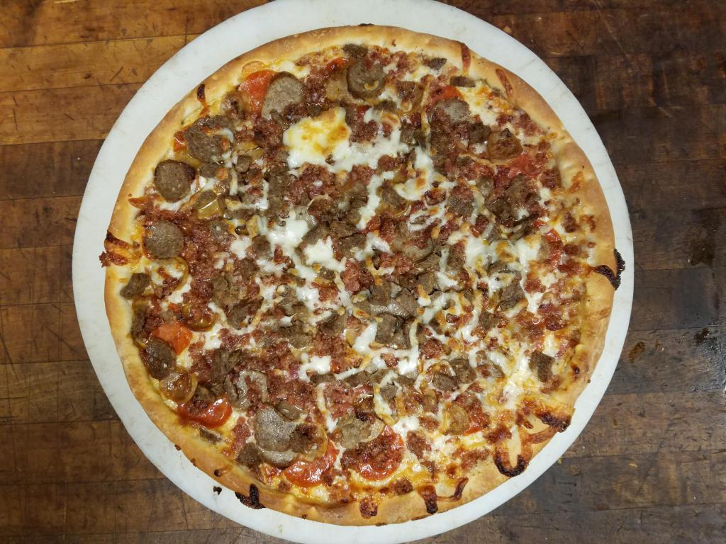 Meat Lovers Pizza · Pizza cheese, pizza sauce, sausage, hamburger, bacon and pepperoni.