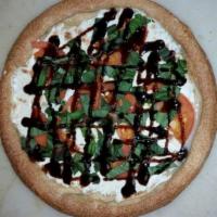 Caprese Pizza · Blend of garlic, Italian spices, sliced fresh mozzarella, sliced fresh tomato, topped with a...