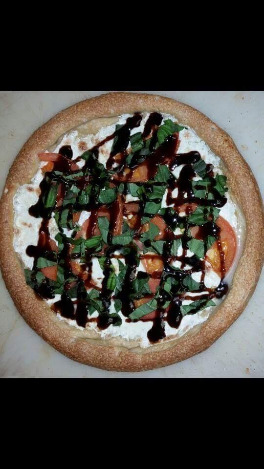 Caprese Pizza · Blend of garlic, Italian spices, sliced fresh mozzarella, sliced fresh tomato, topped with a tangy balsamic glaze and fresh basil.