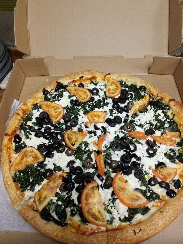 Greek Pizza · Pizza cheese, pizza sauce, feta cheese, spinach, black olives and tomatoes.