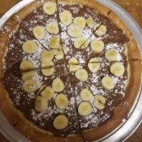 Nutella and Banana Desert Pizza · Crispy pizza shell, topped with nutella and bananas sprinkled with powder sugar