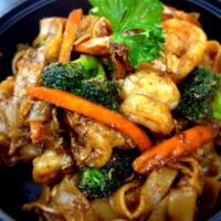 Shrimp Pad See-Ew · Sauteed thick flat noodles with shrimp, eggs, garlic, broccoli and carrots , black pepper wi...