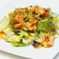 Naked Shrimp Salad · Shrimp lightly grilled to perfection, seasoned with lemongrass, onions and a spicy lime sauc...