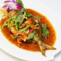 Chili Fish · Whole pompano flawlessly deep-fried, topped with a special garlic chili sauce. Spicy.