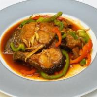 Spicy Catfish · Deep-fried catfish slices sauteéd with curry paste, kaffir lime leaves and bell peppers.