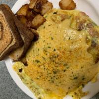 Furnace Brook Omelette · Ham, tomatoes, spinach, cheese and topped with Hollandaise sauce. 3 eggs served with home fr...