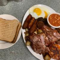 The Hungry Irish Man · 2 eggs, toast, home fries, 2 black and white puddings, 3 Irish bacon, 3 Irish sausages, bach...
