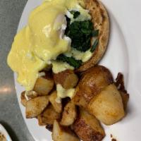 Eggs Florentine · 2 poached eggs and spinach on an English muffin. Served with home fries and creamy homemade ...
