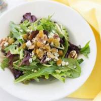 Arugula Salad · Organic arugula with feta cheese, walnuts, and golden beets in a housemade citrus dressing