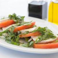 Caprese · Fior di latte mozzarella and fresh tomatoes sprinkled with extra virgin olive oil and fresh ...
