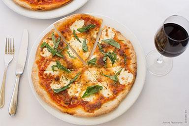 Margherita Pizze · Thin crusted pizza with tomatoes, mozzarella and fresh basil.