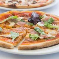 Prosciutto Di Parma Pizze · Thin crust pizza with tomato sauce, Parma prosciutto, arugula, Pecorino Toscano and extra vi...