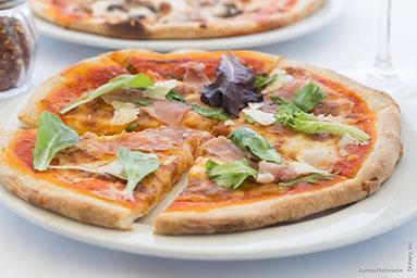Prosciutto Di Parma Pizze · Thin crust pizza with tomato sauce, Parma prosciutto, arugula, Pecorino Toscano and extra virgin olive oil.