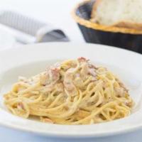 Spaghetti Alla Carbonara · Served with pancetta, creamy egg yolk in Parmigiano sauce.