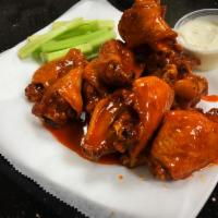 Jumbo Buffalo Wings · Mild, medium, hot, garlic Parm, BBQ or Thai sweet chili. Served with bleu cheese and celery.