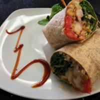 Spicy Thai Shrimp Wrap · Grilled shrimp tossed in spicy Thai mayo, romaine lettuce, carrot, tomato, and cucumber.