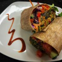 Veggie Burger Wrap · Homemade veggie burger with mixed greens, tomatoes, cucumbers, red cabbage, carrots, bell pe...