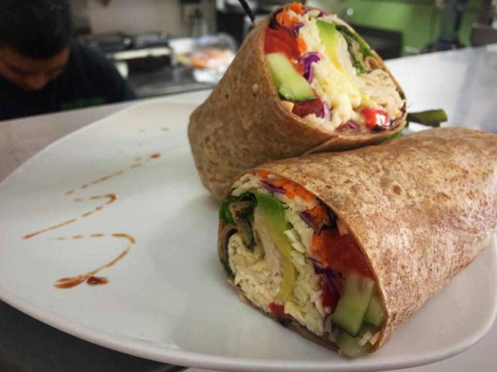 Breast O Cado Wrap · Home roasted turkey breast, avocado, Monterey Jack cheese, mixed greens, tomatoes, cucumbers, carrots, red cabbage, bell pepper with honey mustard dressing.