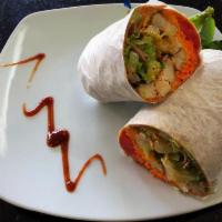 Buffalo Chicken Wrap · Romaine, carrots, tomato, cheddar cheese, grilled Buffalo chicken, and ranch.