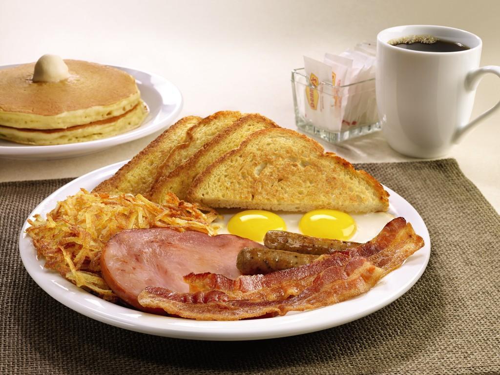 Lumberjack Slam® · Buttermilk pancakes, grilled ham, bacon strips, sausage links, eggs, hash browns and choice of bread.